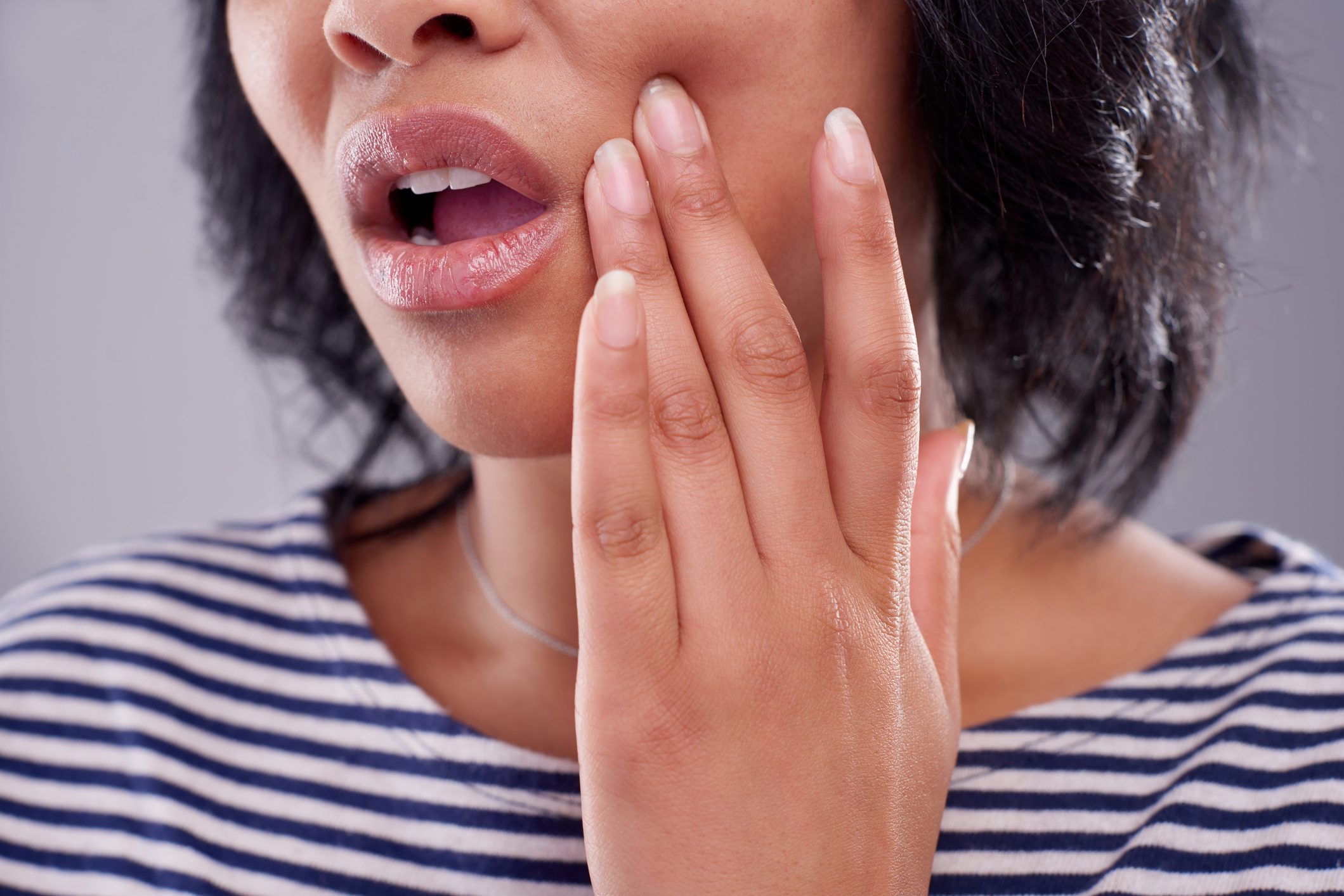 young woman suffering from a toothache