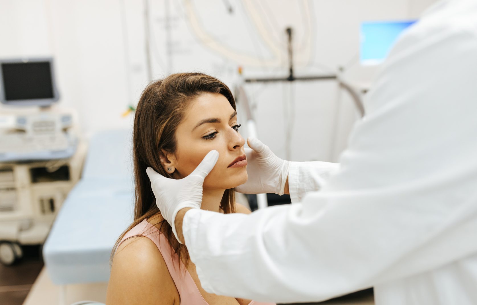 Doctor Examines Patient's Sinuses