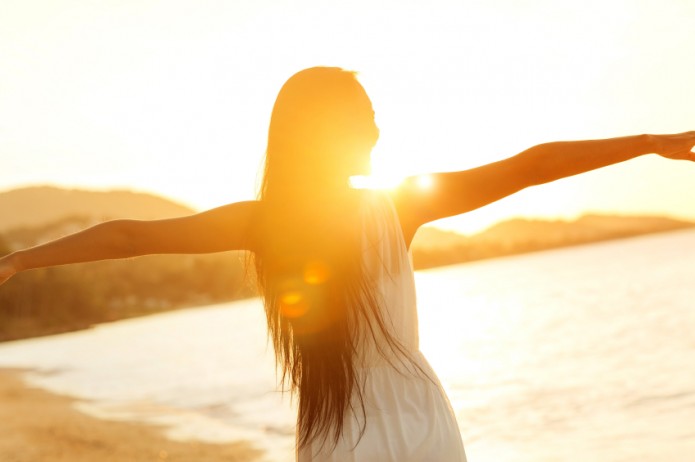 Beautiful girl walking on the beach at sunset, freedom concept ...