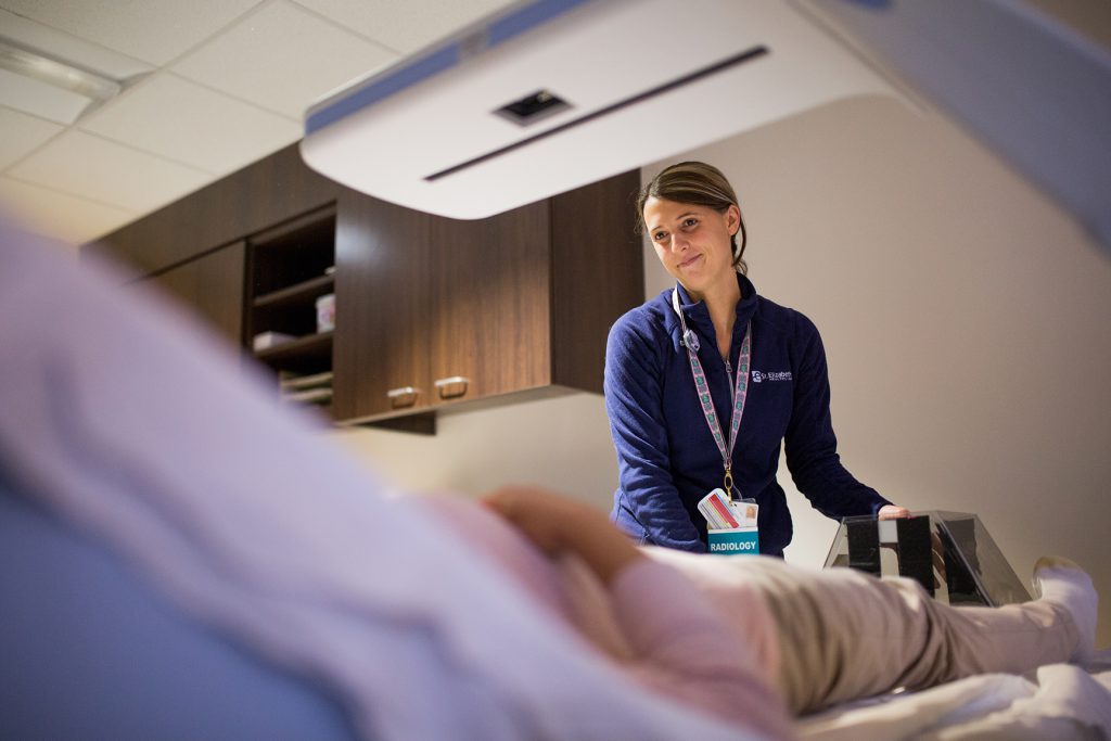 Patient receiving DEXA scan for osteoporosis