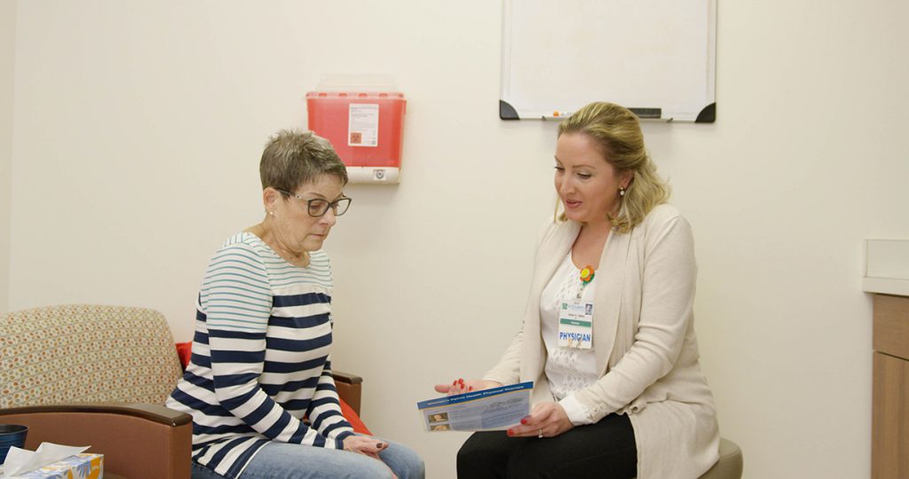 Dr. Oakley consults with female patient about pelvic floor disorders